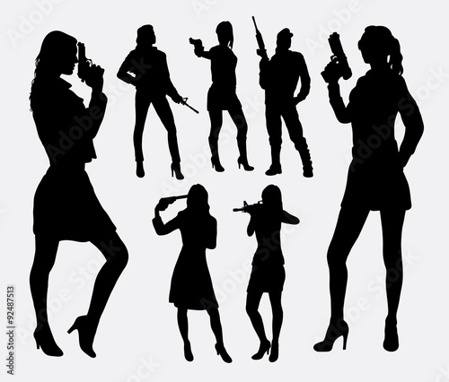 Girl with gun silhouettes. Good use for symbol, logo, web icon, mascot, sign, or any design you want. Easy to use.