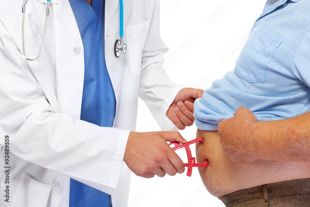 Medical doctor with body fat calipers. Medical doctor with body fat calipers.