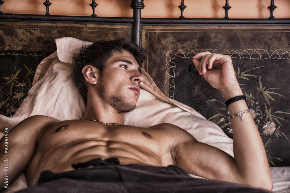 Shirtless sexy male model lying alone on his bed Stock Photo Adobe Stock
