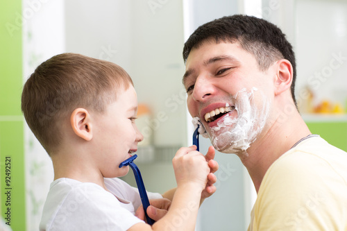 Cute child boy shaving his ...