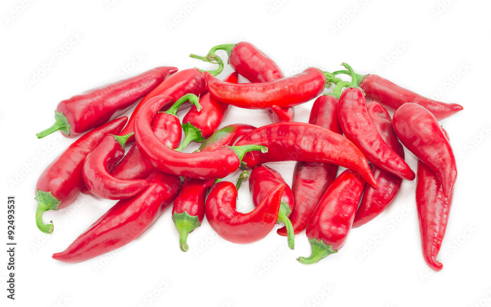 Pile of red peppers chili on a light background