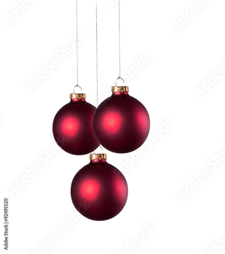 Christmas balls with curly ribbons isolated on the white background