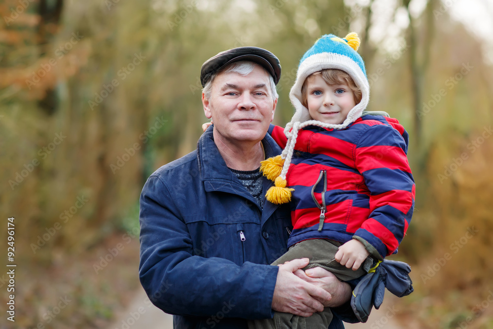 Happy grandfather with his grandchild on arm Happy grandfather with his grandchild on arm