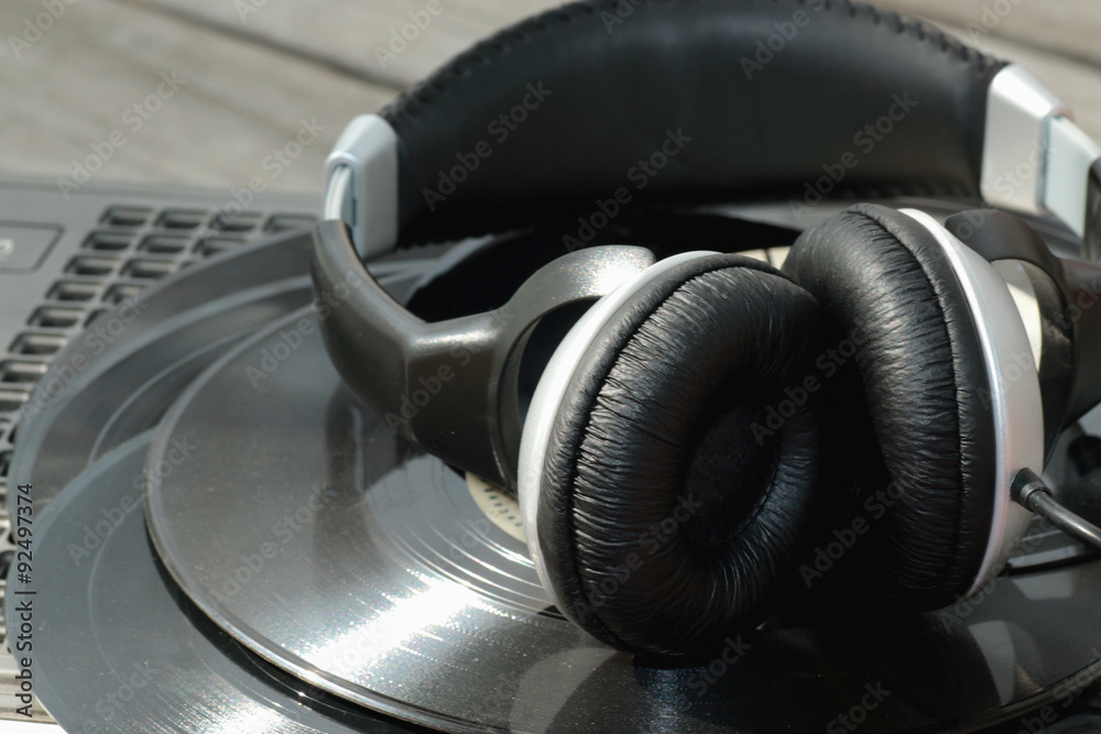 player with headphones on vinyl plates player with headphones on vinyl plates