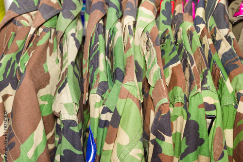 closeup military shirt on hanger in shop