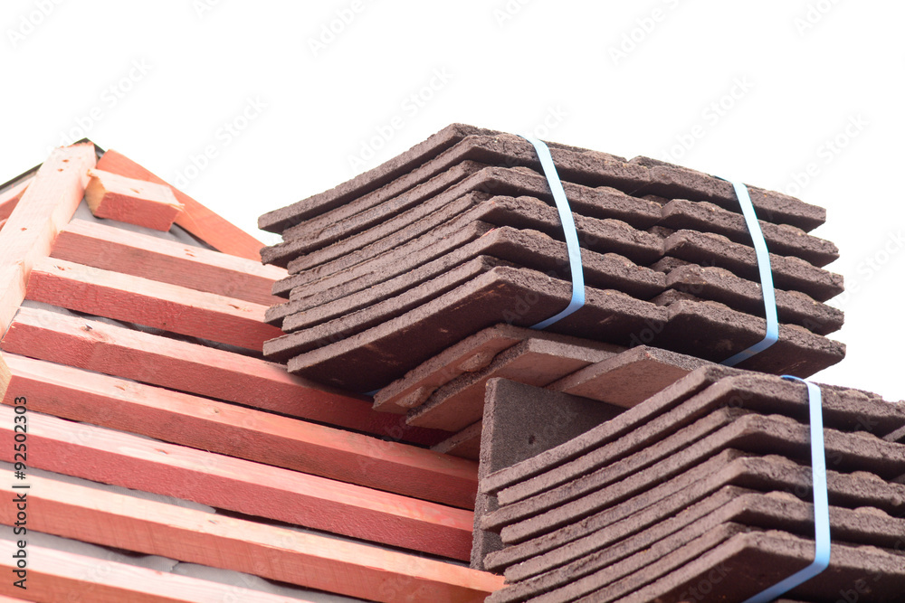 Stacks of roof tiles on roof ready for installation