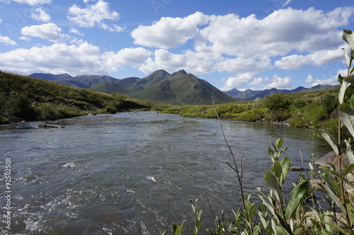 Mountain stream flowing through the tundra valleys of Tombstone Territorial Park in Yukon, Canada
