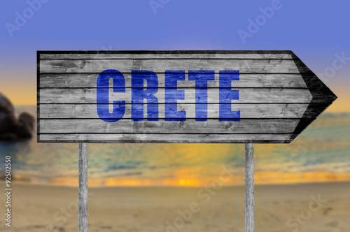 Crete wooden sign with beach background