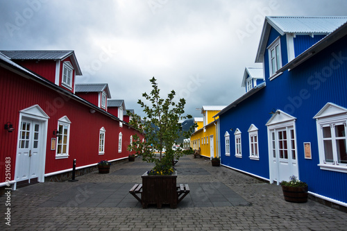Colorful red, blue and yellow houses at Siglufjordur harbor photo