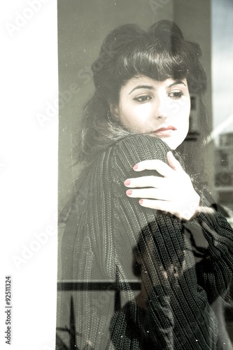 Melancholic Girl at the Window. photo