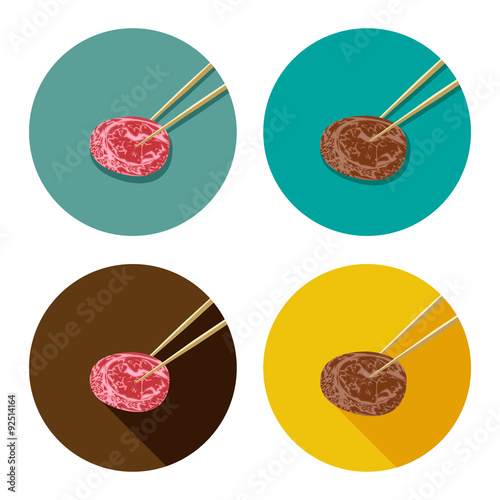 Piece of meat is holding with chopsticks