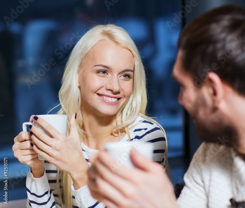 happy couple meeting and drinking tea or coffee