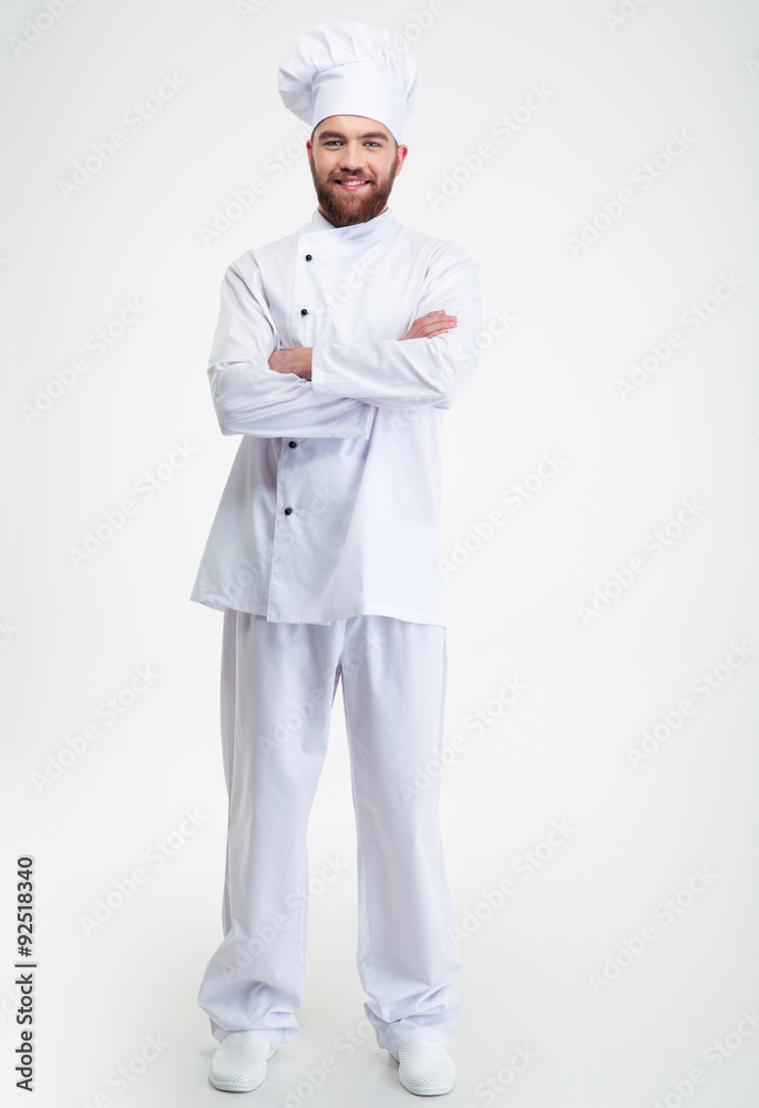Smiling male chef cook standing with arms folded Smiling male chef cook standing with arms folded