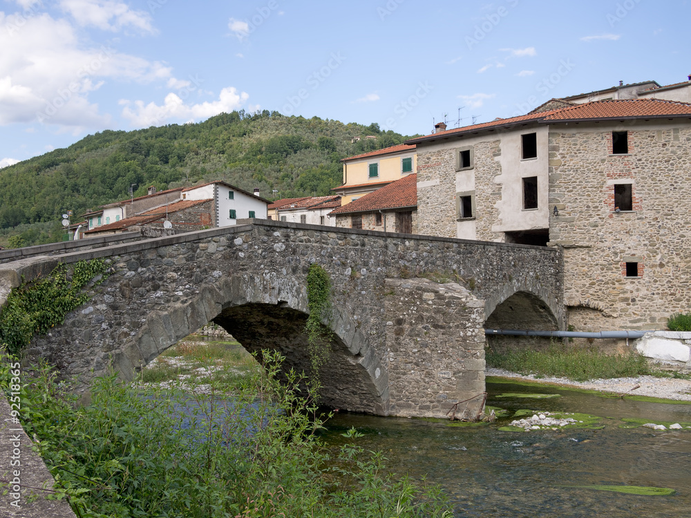 Ancient old bridge at Gragnola in Lunigiana, Italy.