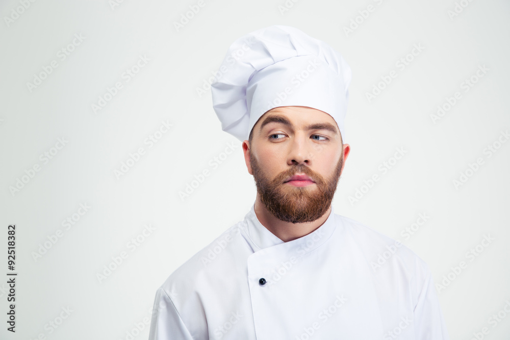 Portrait of a pensive male chef cook looking away Portrait of a pensive male chef cook looking away