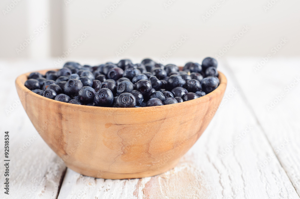 Wooden bowl with forest blueberry Wooden bowl with forest blueberry