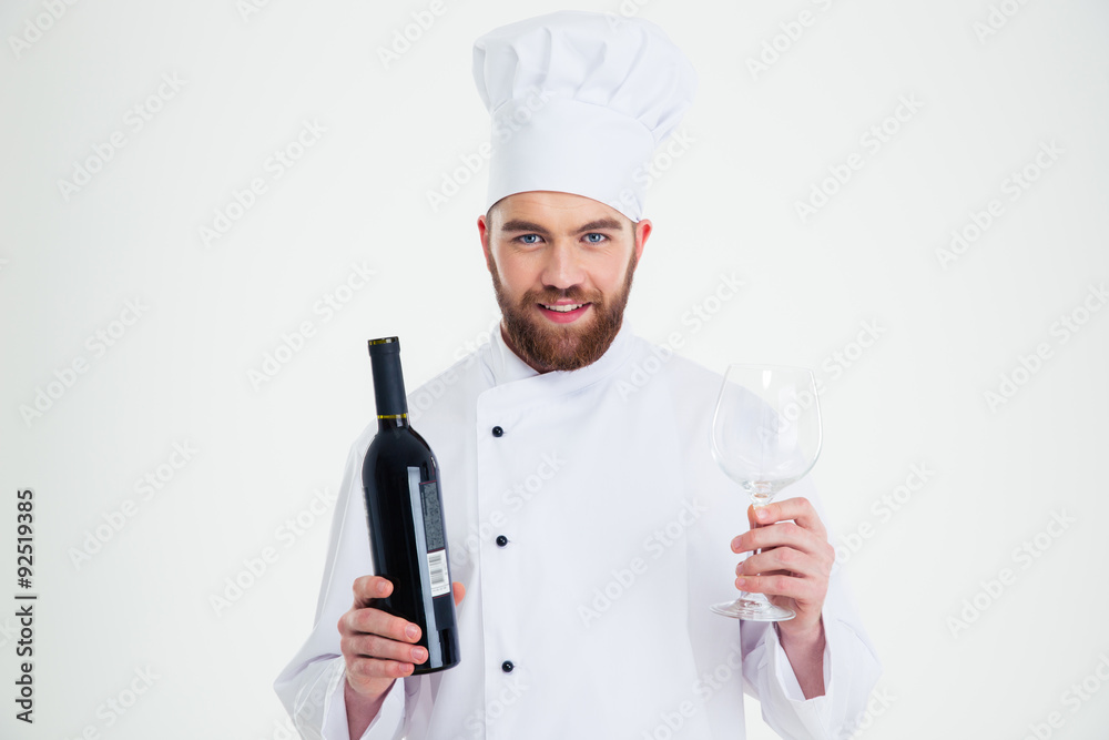 Male chef cook holding bottle of wine and wineglass i Male chef cook holding bottle of wine and wineglass i