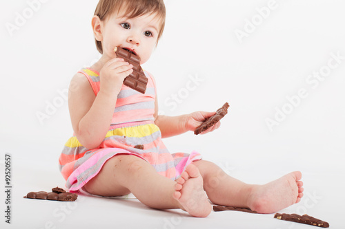 little girl with chocolateon white background