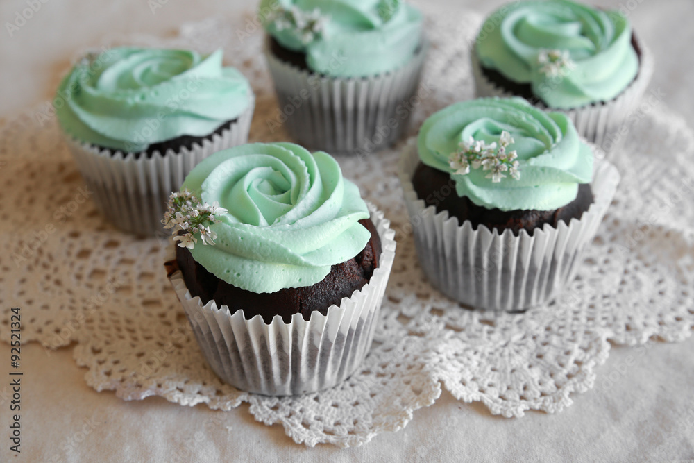 Homemade chocolate cupcake with turquoise rose frosting Homemade chocolate cupcake with turquoise rose frosting