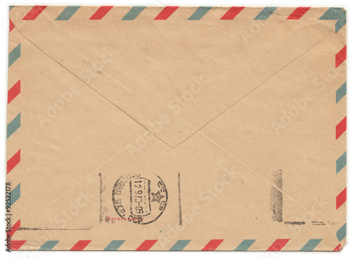 Old paper envelope with meter stamp on rear side and one side cut off. Russian inscription: "Manufactured"