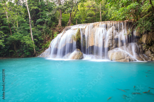 Tropical Waterfall in deep forest © Noppasinw