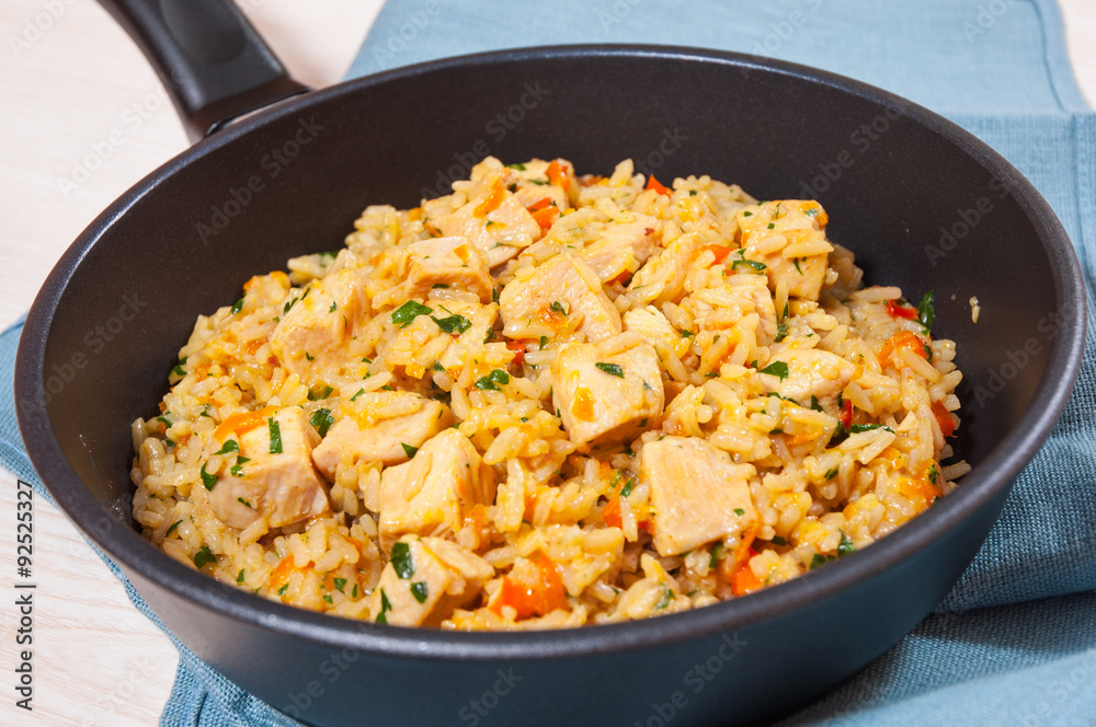 Chicken Breast with Rice and vegetables in a frying pan Chicken Breast with Rice and vegetables in a frying pan