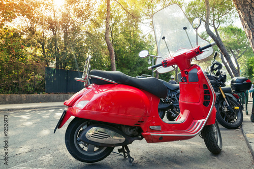  Classic red old style scooter stands parked photo