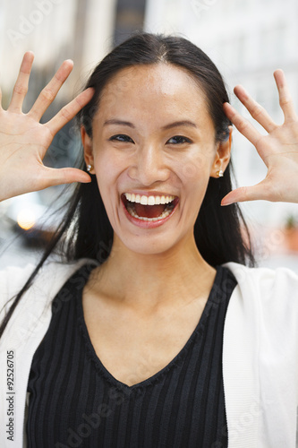 Attractive Smiling Woman Hands Up and Open