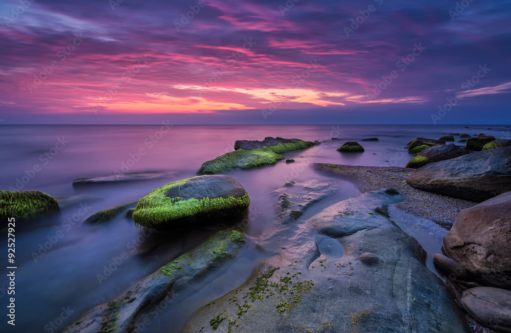 Sea rocks at sunrise. Magnificent sunrise view in the blue hour at the Black sea coast, Bulgaria 