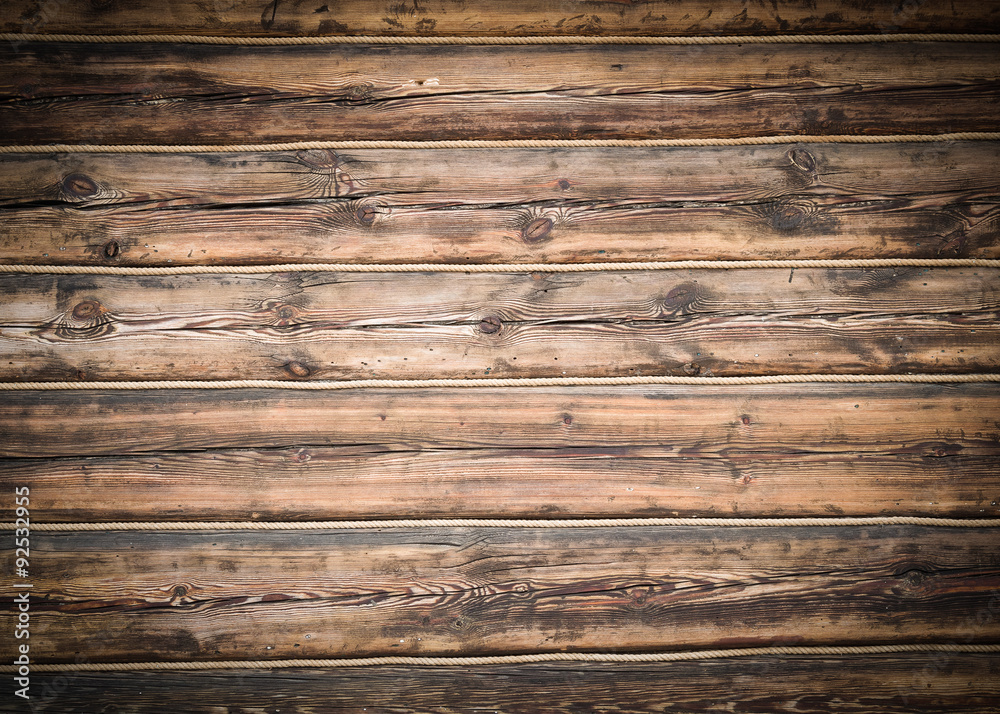 Naklejka premium Wooden logs rope wall texture background