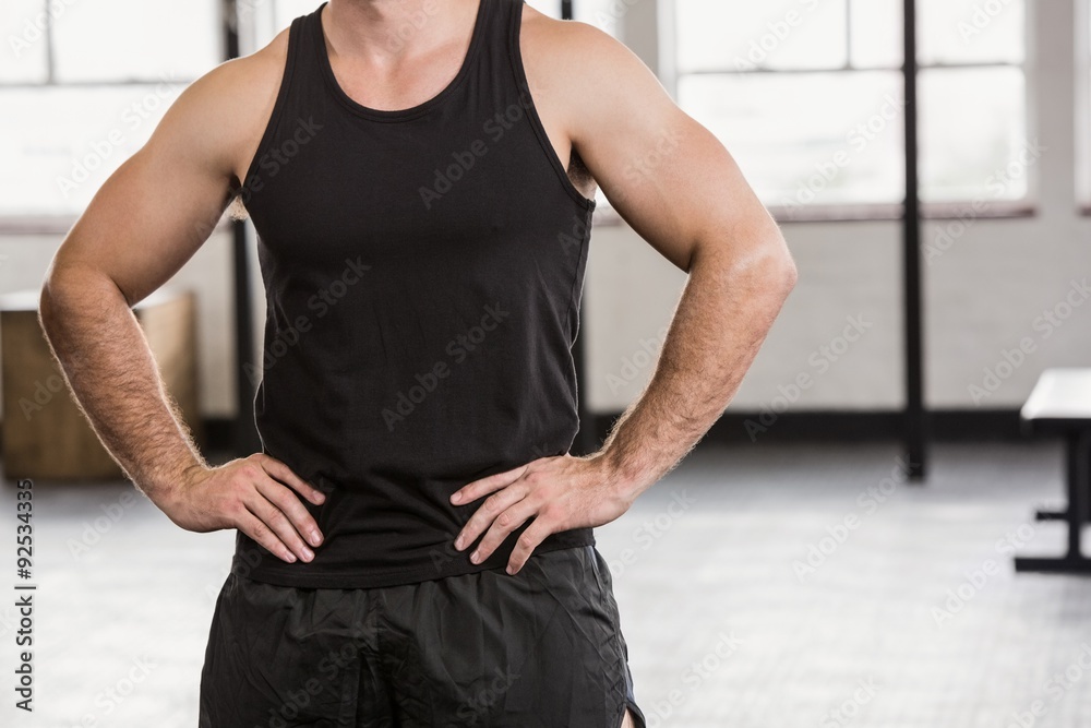 Obraz premium Midsection of man with hands on hip