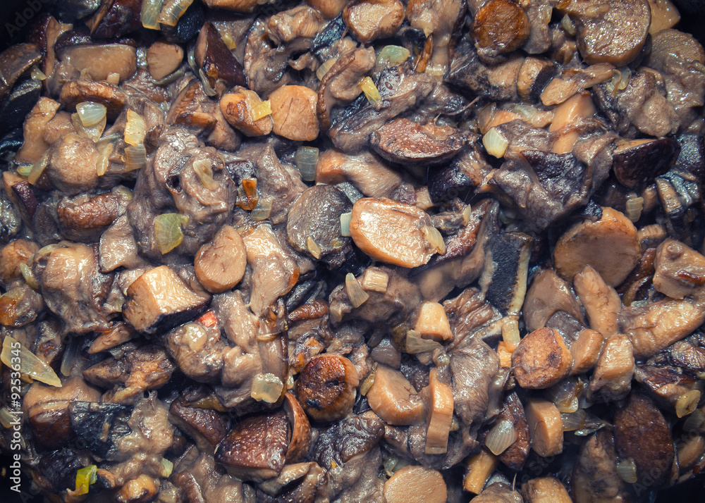 Closeup view of roasted wild mushrooms and onion Closeup view of roasted wild mushrooms and onion