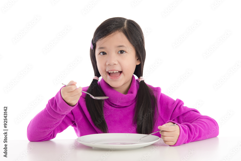 Beautiful asian girl holding a spoon and fork Beautiful asian girl holding a spoon and fork