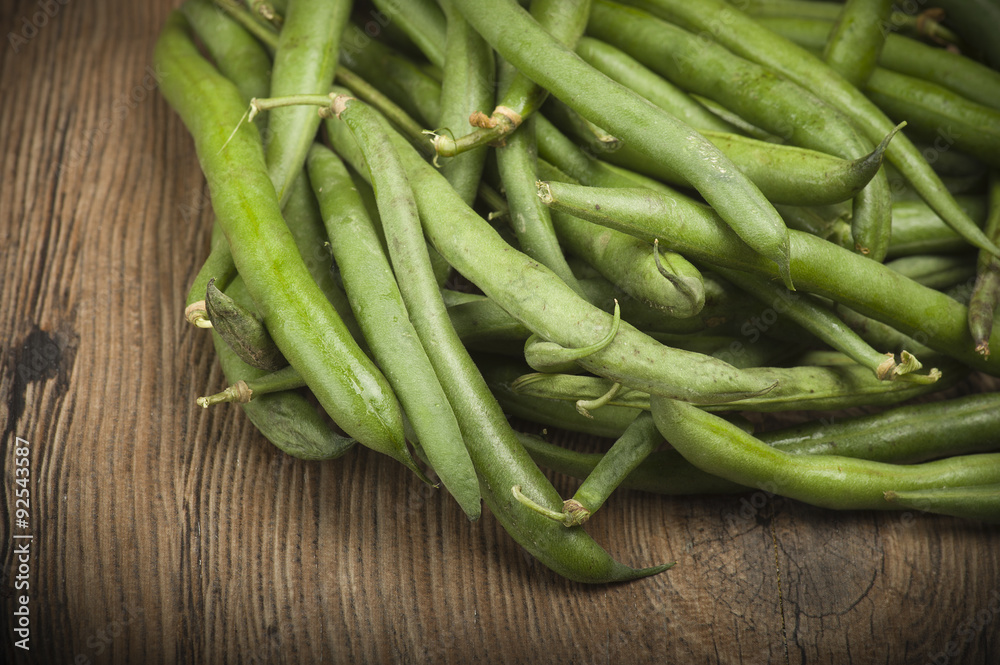 Group of green beans on the wood. Group of green beans on the wood.