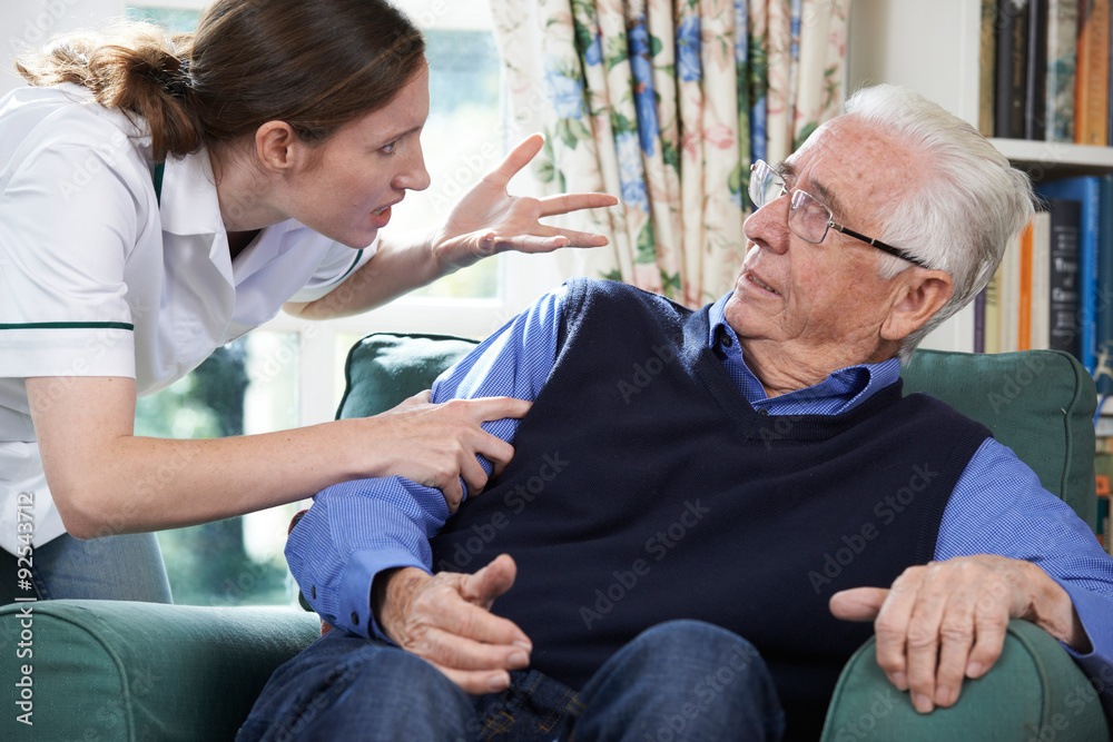 Care Worker Mistreating Senior Man At Home Care Worker Mistreating Senior Man At Home