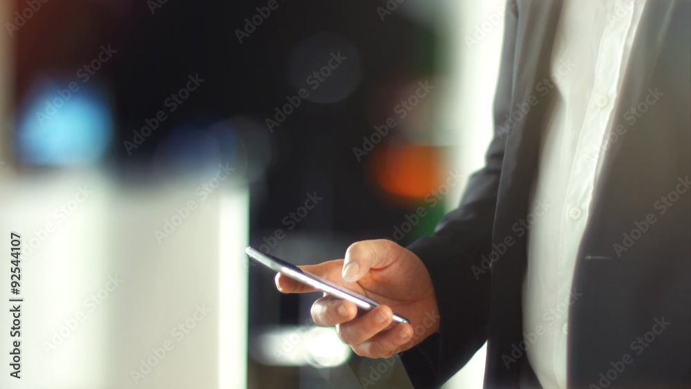 4K - UHD: Business Man using Mobile Phone in Office. 4K - UHD: Business Man using Mobile Phone in Office.