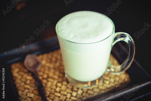 Hot milk in a glass on  wooden Backgrounds