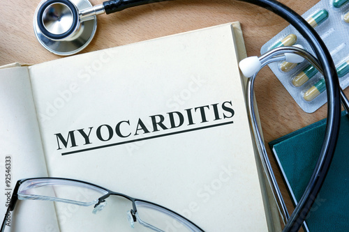 Myocarditis concept. Book with stethoscope and pills. photo