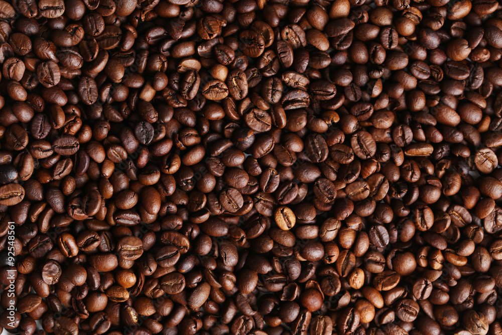 Fototapeta premium Roasted coffee beans background, close up