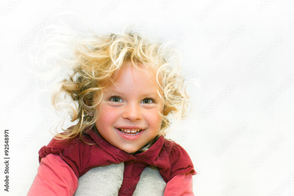 Portrait of a girl. smiles. looking from the top. Age 4 years.