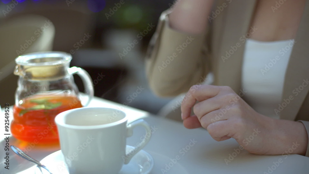 business women uses smartphone in a cafe, close-up business women uses smartphone in a cafe, close-up