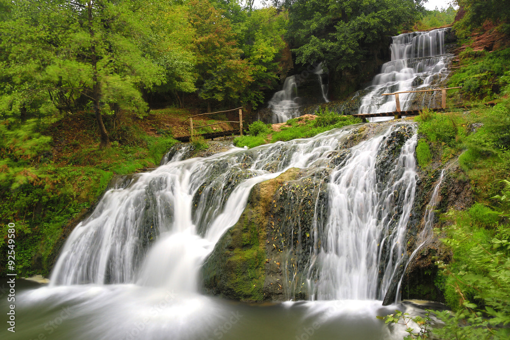 Fototapeta premium Nice waterfall in autumn forest