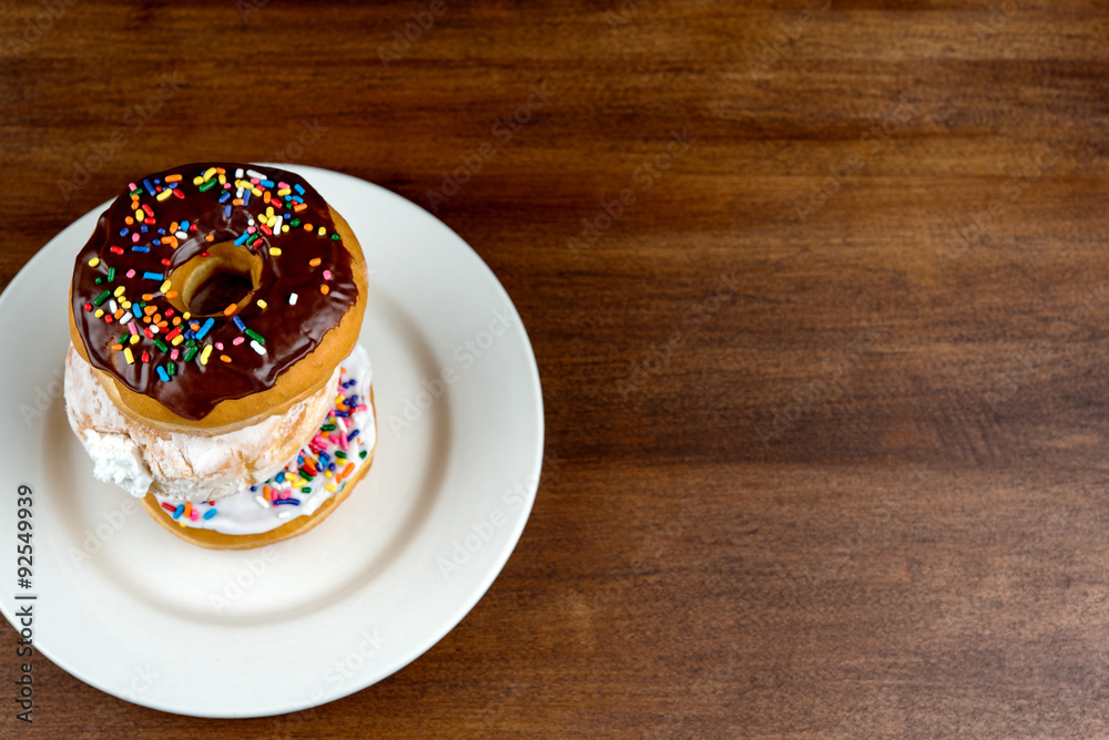 Stacked donuts on brown table. Shallow depth of field Stacked donuts on brown table. Shallow depth of field