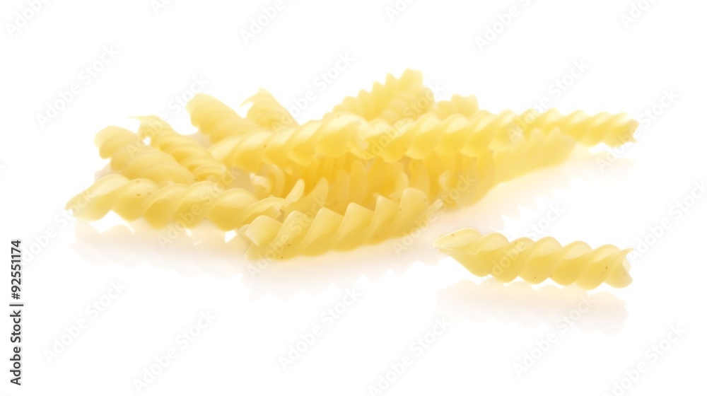 Many fusilli pasta isolated on white