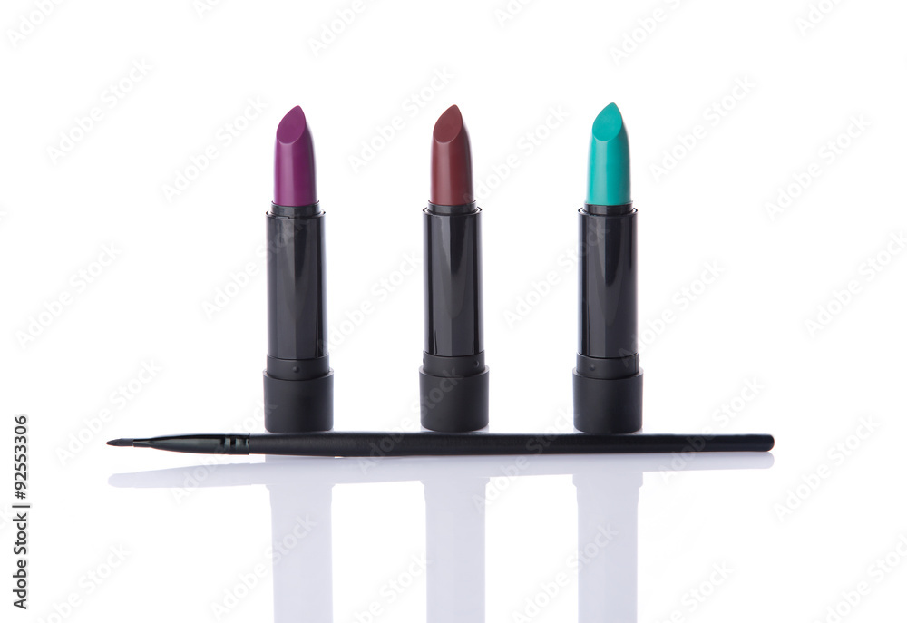 Obraz premium Trendy lipsticks and makeup brush