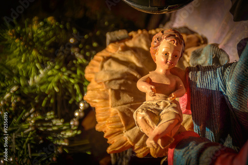 Artistic vintage Christmas nativity scene with baby Jesus