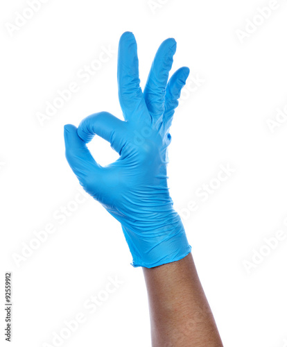 Hand of a medic wearing a blue latex gloves