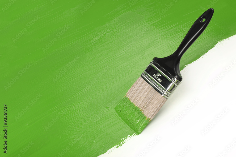 Naklejka premium Paintbrush With Greeen Paint