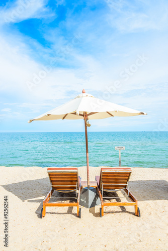 Fototapeta Naklejka Na Ścianę i Meble -  Umbrella and chair on beautiful tropical beach