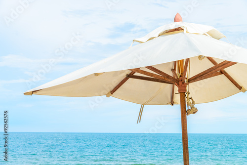 Umbrella and chair on beautiful tropical beach © siraphol